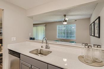 a kitchen with a sink and a window